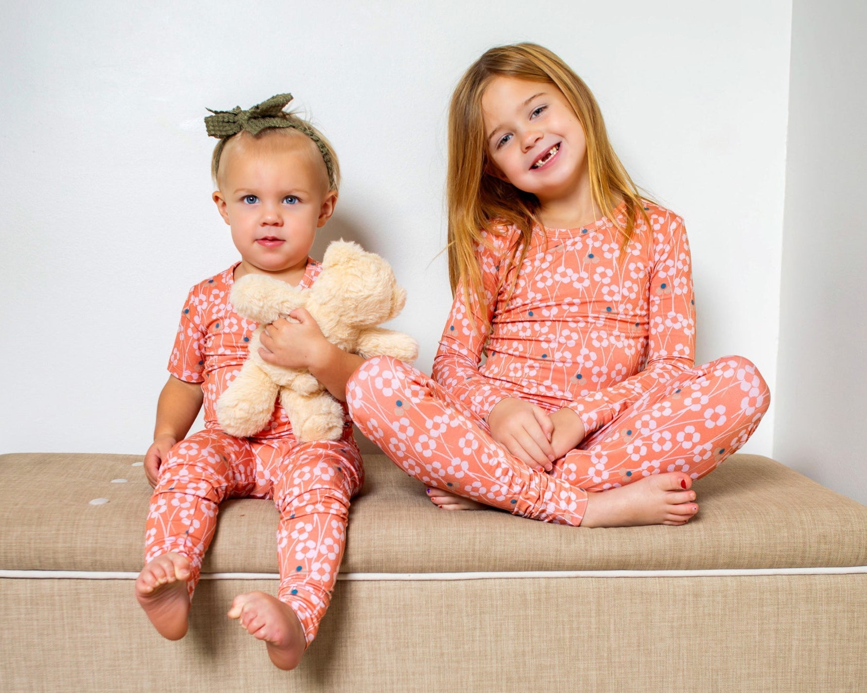 Bright and whimsical orange blossom bamboo pajama set with soft, breathable fabric for dreamy comfort. Available in short or long sleeves with pants.