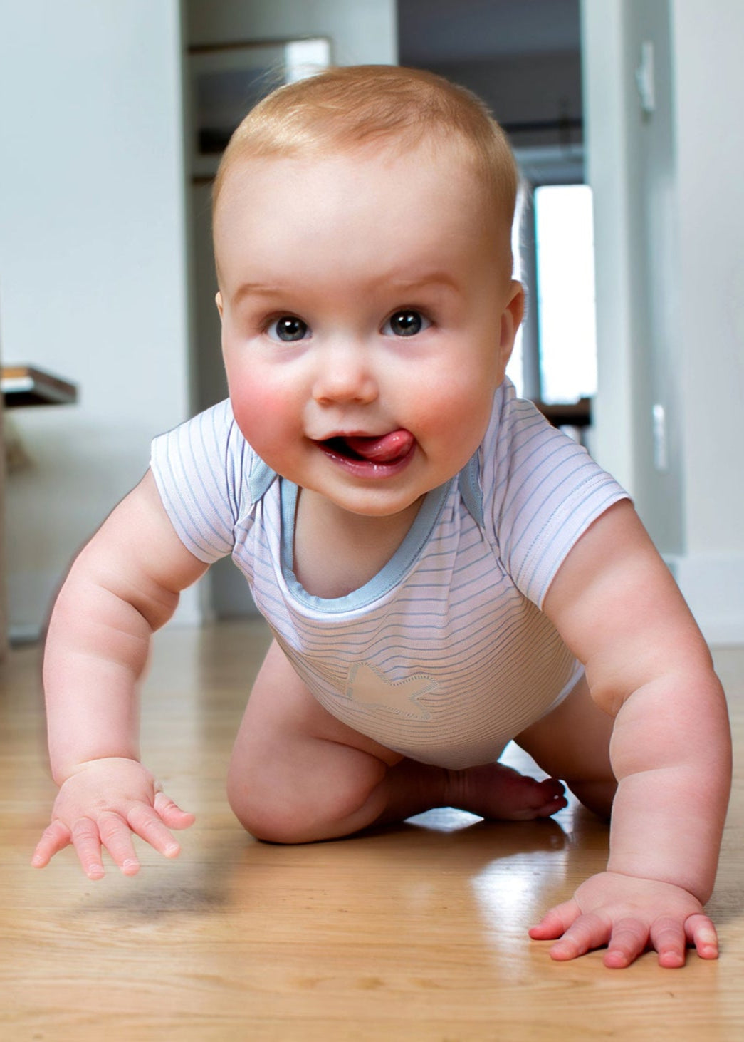 Earthly Threads essential bodysuit or onesie for baby with sky blue and white stripes with cloud or star detail, perfect for hot summer nights or layering for comfort.