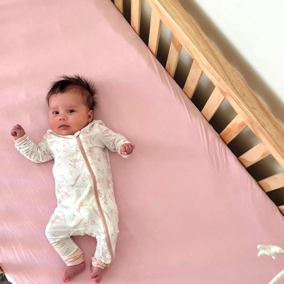 Organic bamboo crib sheet from Earthly Threads. Pink crib sheet for eczema.